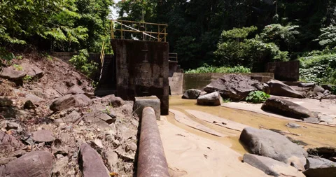 Water dam of mini hydro power plant at jungle river, establishing shot Stock Footage 314769911