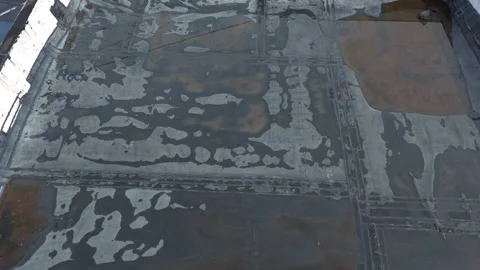 Water damaged rubber flat rooftop with overflow of rainfall flooding Stock Footage 341685947