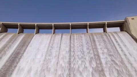 Water discharge from the upper section of a gravity dam. Dam spillway releasing Stock Footage 340918588