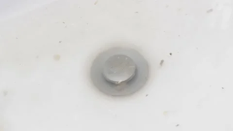 Water does not go down well into the drain of the bathroom Stock Footage 236055433