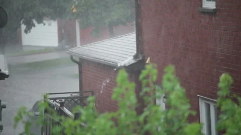 Water drain from side of a house during heavy rain Stock Footage 40641514