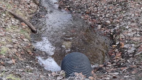 Water drainage pipe. Flowing fast. Stock Footage 312163895