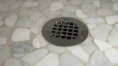 Water draining down drain slow motion Stock Footage 156264774