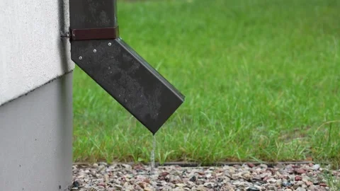 Water Draining From a Gutter in summer rain Stock Footage 260366681