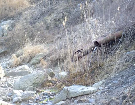 Water Draining from an old Rusty Pipe Stock Photos