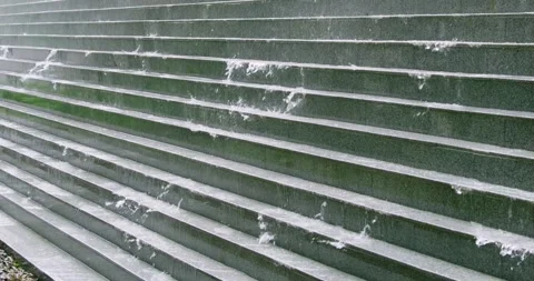 Water draining from steps urban environment city scene close-up natural elements Video stock 305021512