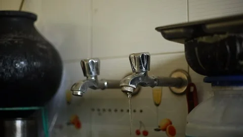 Water Driping From The Tap Into A Sink Stock Footage 129951033