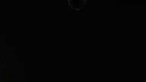 Water Dripping Against a Black Background Stock Footage 82633255