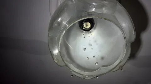 Water Dripping from Ceiling Light Fixture CloseUp | Flooded Apartment Chandelier Stock Footage 344929372