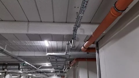 Water dripping from the ceiling of an underground garage, pipe malfunction Stock Footage 265330668