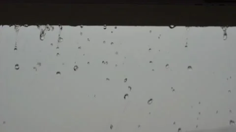 Water Dripping Off of a Gutter During a Rain Storm Video stock 62867827