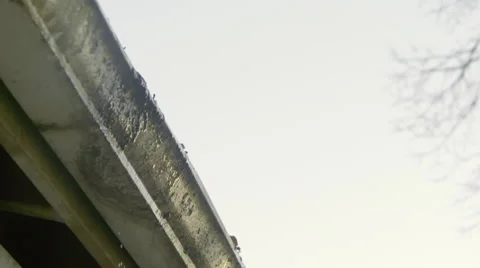 Water dripping from gutter Stock Footage 60751070