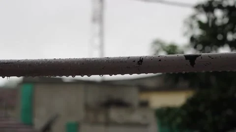 Water dripping from the metal rod in rainy days Stock Footage