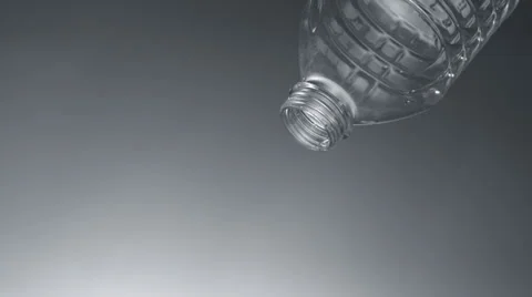 Water dripping out of plastic bottle, Slow Motion Stock Footage 31819701