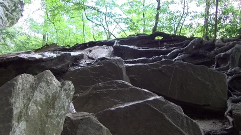 Water dripping over a rock bed 스톡 동영상 90157724