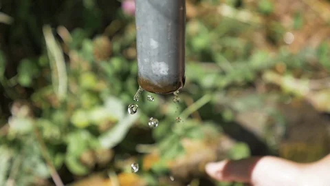 Water dripping from a pipe Stock Footage 106203073