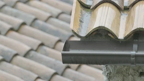 Water dripping into a rain gutter Stock Footage 160151595