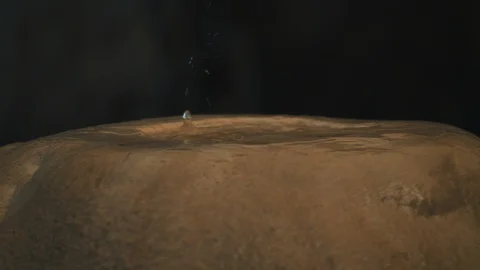 Water dripping on a rock formation inside a cave. Stock Footage 94957299