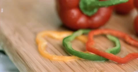 Water dripping on sliced peppers in super slow motion Stock Footage
