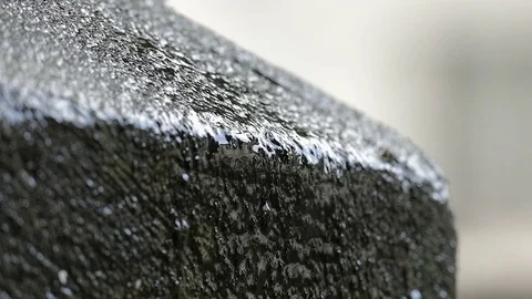 Water dripping slowly on stone Stock Footage 72946636