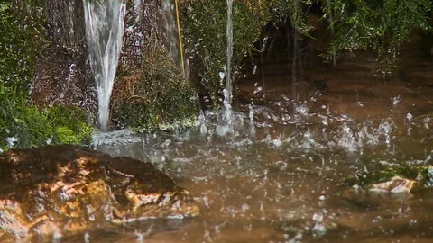 Water dripping into a small space Stock Footage 110365741