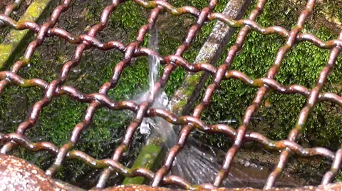 Water Dripping On Steel Grid Stock Footage
