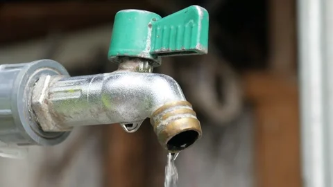Water dripping from a tap or pipe Stock Footage 304773448