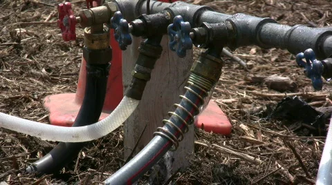 Water dripping from three hoses 스톡 동영상 553546