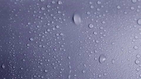 Water drips and flows down on a surface.  Stock Footage 158288119