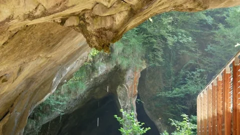 Water drips from the ceiling of a cave in Parco Grotte del Caglieron, Italy Stock Footage 149253688