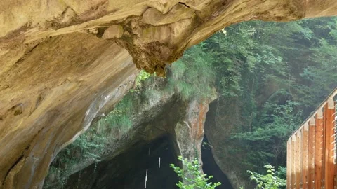 Water drips from the ceiling of a cave in Parco Grotte del Caglieron, Italy Stock Footage 149253990