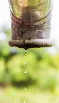 Water drips from a pipe. Stock Photos