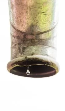 Water drips from a pipe. Stock Photos