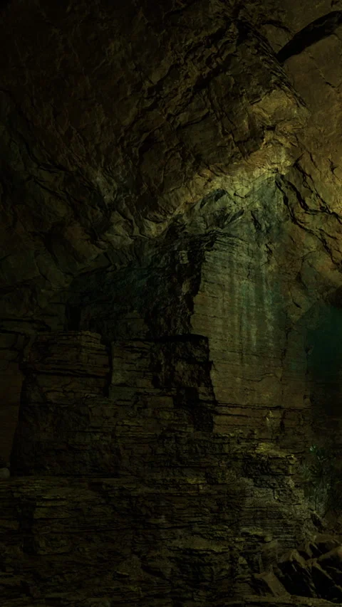 Water drips from rocks inside a dark cave during a quiet moment Stock Footage 331754581