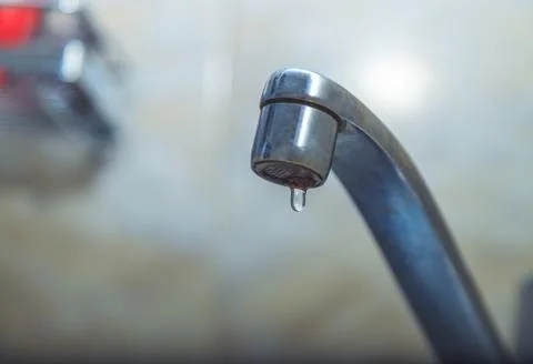 Water drips from the tap Stock Photos