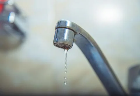 Water drips from the tap Stock Photos