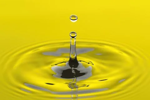 Water drop abstract in yellow reflected water. Stock Photos