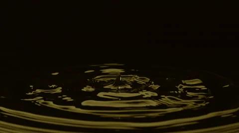 Water drop against black background. Slow Motion. Stock Footage 55538722
