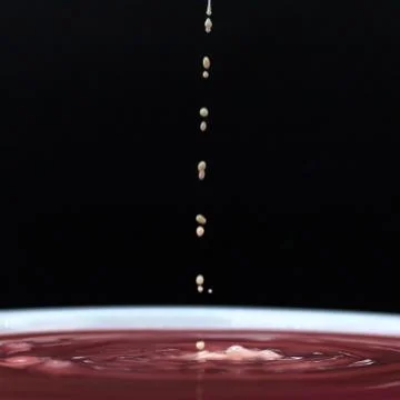 Water drop and splash Stock Photos