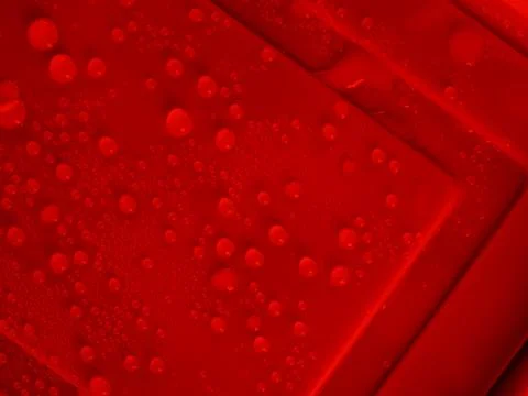 Water drop cold red background pattern surface circle droples rain Stock Photos