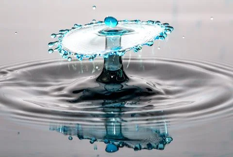Water Drop Collision and Reflection Stock Photos