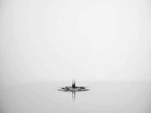 Water drop drips to liquid surface 4k slow-motion video nature copy space Stock Footage 83100075