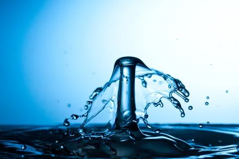 Water drop falling and colliding Stock Photos
