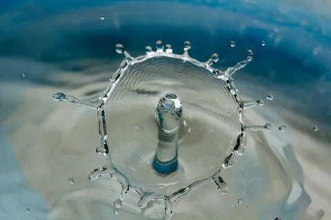 Water drop falling and colliding Stock Photos