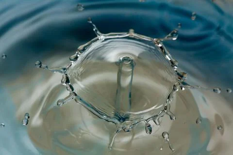 Water drop falling and colliding Stock Photos