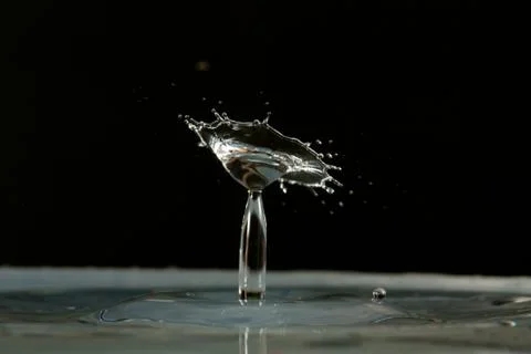 Water drop falling and colliding Stock Photos