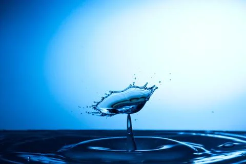 Water drop falling and colliding Stock Photos