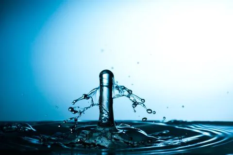 Water drop falling and colliding Stock Photos
