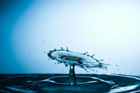 Water drop falling and colliding Stock Photos