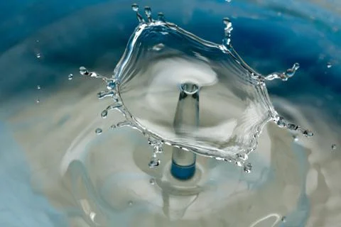 Water drop falling and colliding Stock Photos